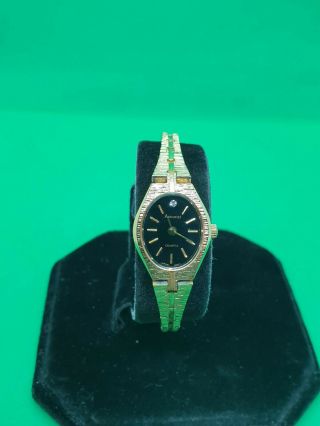 Ladies Vintage Accurist Gold Tone Bracelet Dress Watch,  Black Face & Gold Hands.  1