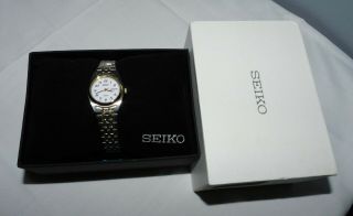Seiko Solar 26mm White Dial Two - Tone Stainless Steel Ladies Watch Sut116