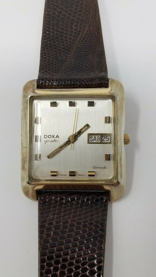 Vintage Doxa Grafic Automatic Day Date Square Watch Keeping Time Wears Larger
