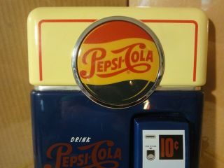 Vintage Pepsi Cola pop bottle machine,  touch tone phone,  wall telephone. 2