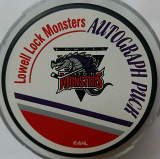 Unknown Sig Lowell Lock Monsters Official Autograph Puck Ahl Signed Hockey Puck