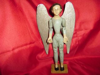 Rare Antiquated 9 1/4 Inch Wooden Santos Doll With Metal Wings.