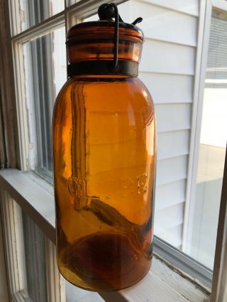 Pristine Honey Amber Half Gallon Globe Fruit Jar With Embossed Base 2.