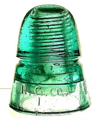 Milky Shower & Milky Streak.  Darker Green Aqua H.  G.  Co.  145 [130] Glass Insulator
