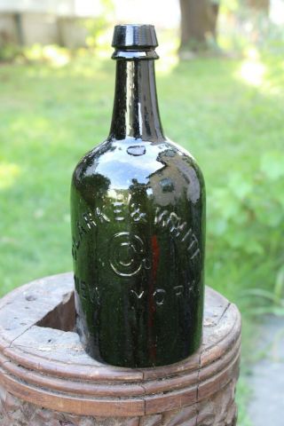Clarke & White Mineral Water Bottle.  Dark Green Glass,  Open Bubbles & Defects