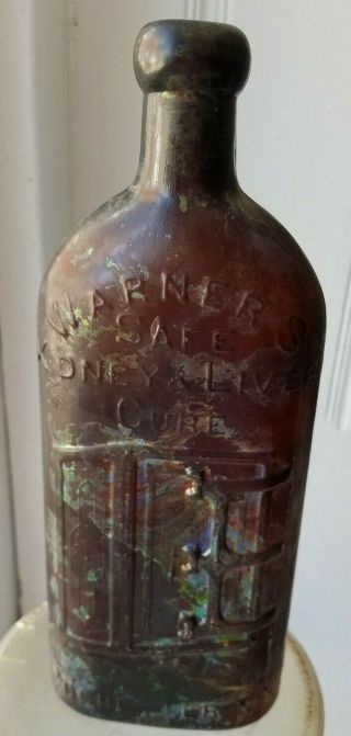 Antique Amber Bottle Embossed Warner 
