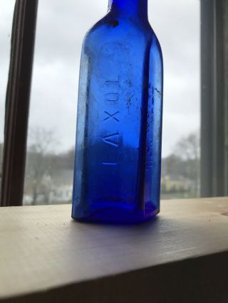 Laxol A J White.  York Embossed Glass Bottle Cobalt Blue - Patented 1894 2