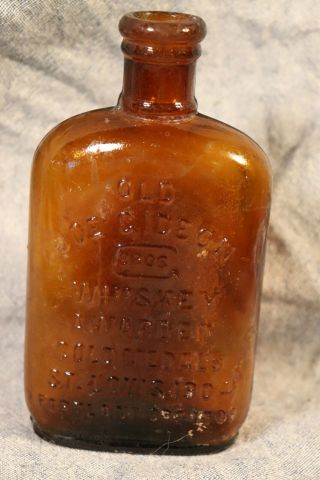 Bimal Amber 1/2 Pint Whiskey Flask,  Old Joe Gideon Whiskey Portland Ore.  1905