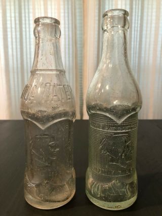 2 Indian Bottles,  Coca - Cola Soda Water & Roundup Bottling Both Pat’d 1925
