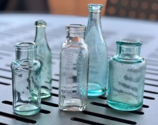 Group Of Five (5) Bottles,  Some Embossed,  Bengal Bluing,  Hires Household Extract