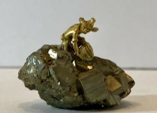 Figure Of Prospector Miner On Pyrite Crystal Fools Gold Cluster
