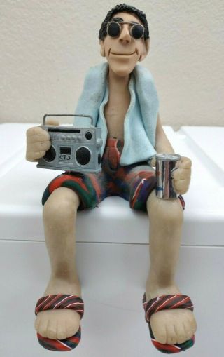 D.  Manning Shelf Sitters Sitting Beach Man Beer Can Radio Limited Ed.