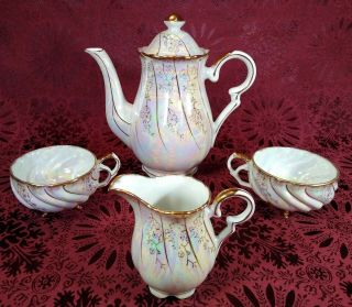 Vintage White Iridescent Gold Leaf Accents Teapot,  Creamer,  Two 3 Foot Cups Set