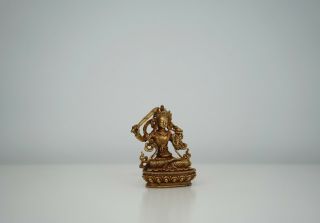 A Small Bronze Figure Of Seated Manjusri