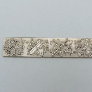CHINESE WHITE METAL SCROLL WEIGHT DECORATED WITH BUDDHISTIC PRECIOUS OBJECTS 2