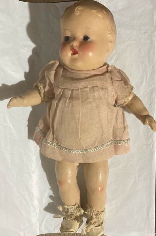 Antique Composition 12.  5 " Baby Doll,  Molded Hair,  Blue Eyes,  Pink Dress,  No Mark