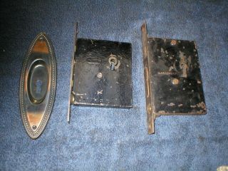 Two Antique Japanned Pocket Door Locks And One Plate