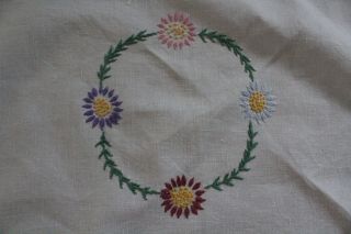 Vintage white table cloth with hand embroidered coloured flowers. 3