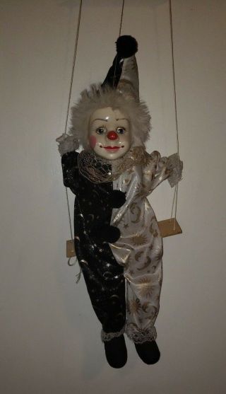 Vintage Porcelain Clown Doll Dressed In Shiny Black & Silver On Hanging Swing