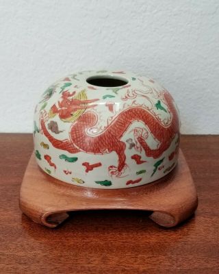 A Chinese Porcelain Scholars Brush Pot With Dragons And Wood Stand
