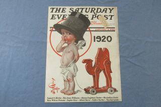 January 3 1920 J.  C.  Leyendecker Cover With Years Baby And A Pull Toy Camel