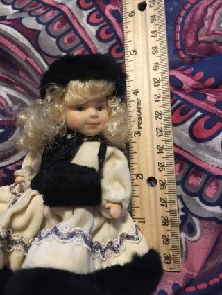 Small 4 Inch Porcelain Doll,  Black And White Winter Clothes