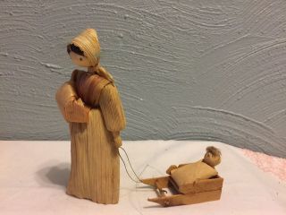 Unique Vintage Corn Husk Woman Pulling A Girl In A Wooden Sled •