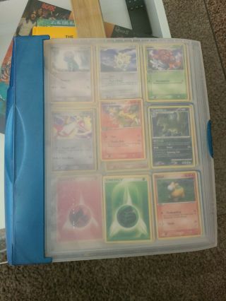Binder Of Various Pokemon Cards Including Mewtwo,  Moltres,  And Multiple Others