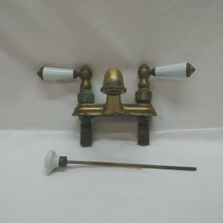 Vintage Brass Bathroom Sink Faucet With White Porcelain Handles