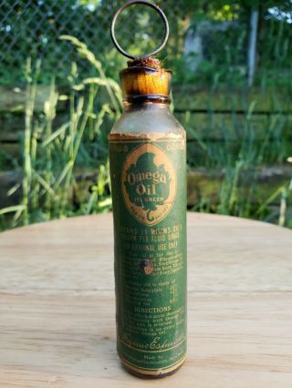 Antique Omega Oil Cork Top Bottle Labeled Embossed W/ Contents Vintage
