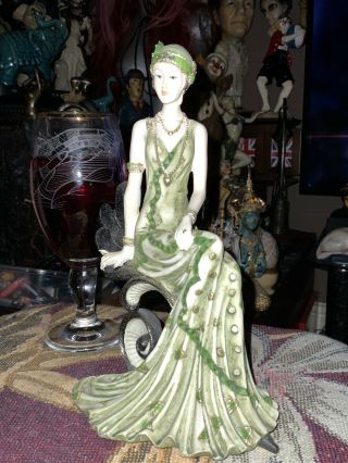 Art Deco Styled Figure Lady Sitting In Green Dress