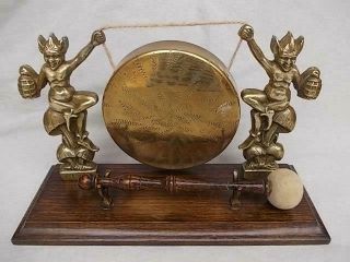 652 / A 1920s - 1930s Brass Cornish Pixie Table Gong On A Wooden Base