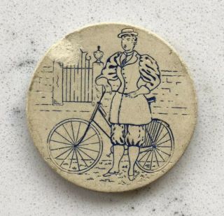 Antique Clay Poker Chip Figural Woman Standing Beside Bicycle Bike
