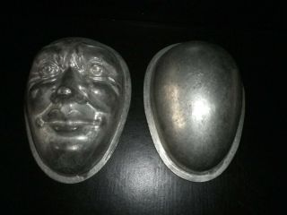 Vintage metal chocolate mould/mold - 2 half egg molds,  one with male face. 2