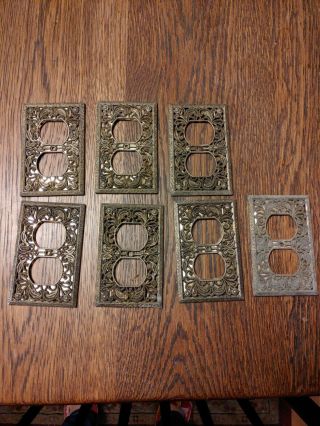 7 Vintage Ornate Metal Outlet Covers Brass?