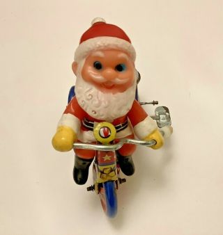 Vintage Wind Up Tin Santa Claus On A Bike Toy Runs Like A Demon