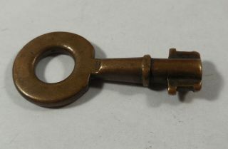 Very Small Well Worn Vintage Brass Barrel Key With Round Bow And Double Cut Bit.