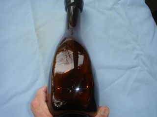 antique blown glass bottle amber in color 2