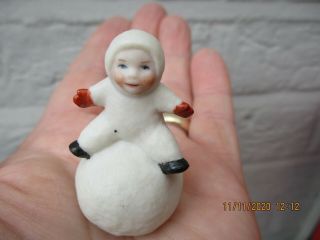 An Antique Vintage Porcelain Snow Baby On Snowball Cake Decoration Topper - C1920