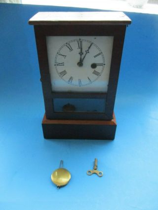 Small Antique Wood Cased Mantle Shelf Clock With Key & Pendulum Runs
