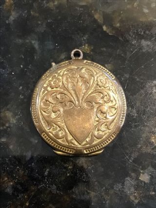 Antique Vintage Yellow Metal Probably Brass Locket Holds Two Photos Inside