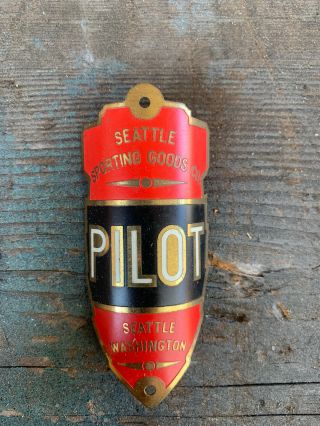 Antique Nos Seattle Sporting Goods Pilot Bicycle Head Badge Head Tag Emblem