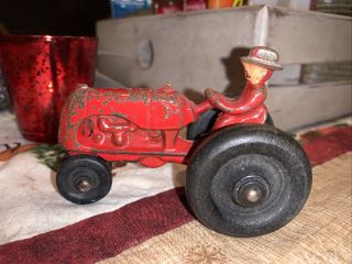 Antique Cast Iron Tractor W Driver.  Wooden Wheels.  Unmarked.