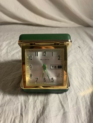 Vintage Bulova Mechanical Watch With An Alarm Clocks In A Green Travel Box