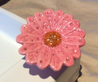 Nora Fleming mini.  Pink daisy with nf initials.  Retired - rare 2
