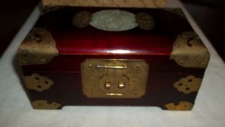 Vintage Chinese Red Wood Brass Decal Jewellery Box With Carved Jade Centrepiece