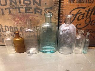 7 Embossed Patent Quack Bottles Antique Medicine Druggist Pharmacy Apothecary