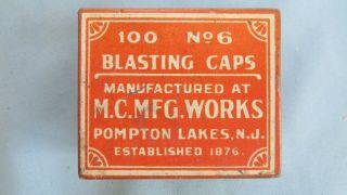Rare Red Metallic Cap Manufacturing Co.  100 No.  6 Scroll Style Blasting Cap Tin