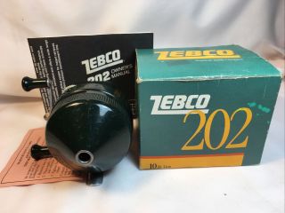 Vintage “green” Zebco Model 202 Spinning Reel And Instructions