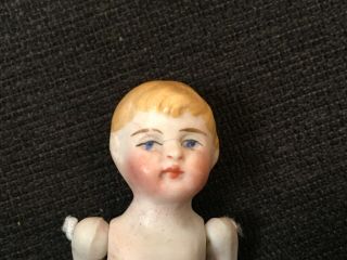 Antique 2 3/4” All Bisque German Dollhouse Mignonette Doll w Painted Face.  Ador 2